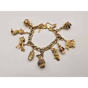 Vintage Monet Charm Gold Tone Bracelet With 9 Charms Safety Chain 7"